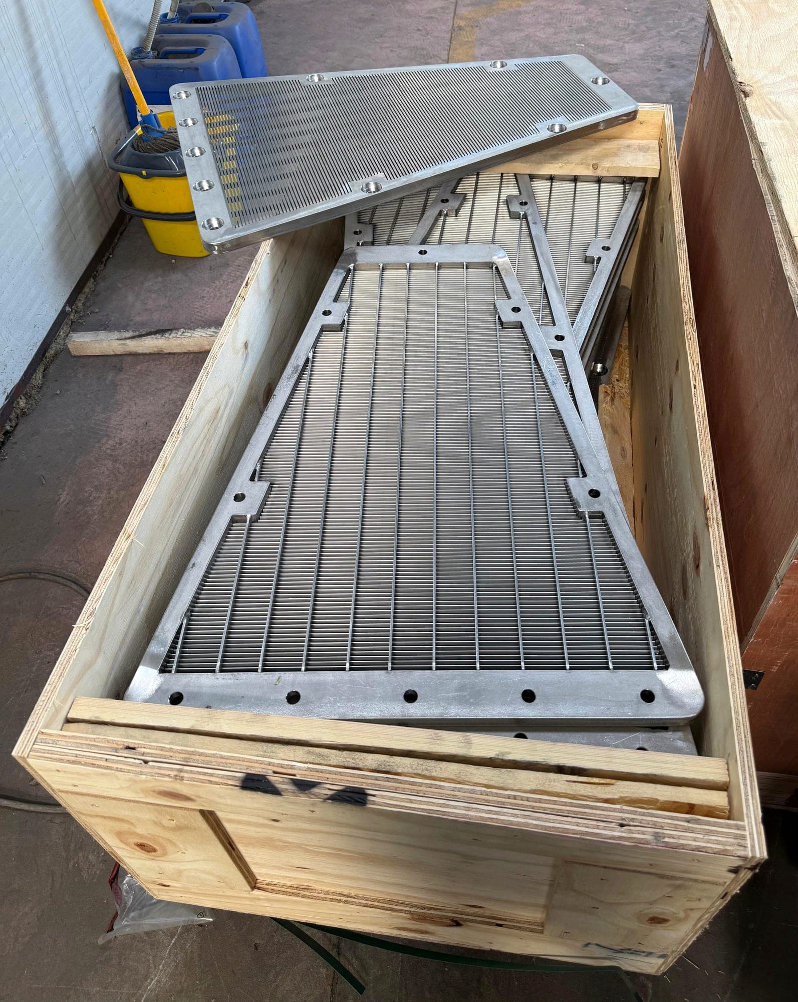 Wedge-wire screen panels crated for dispatch